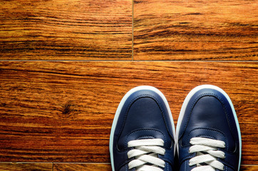 sneakers on wooden floor