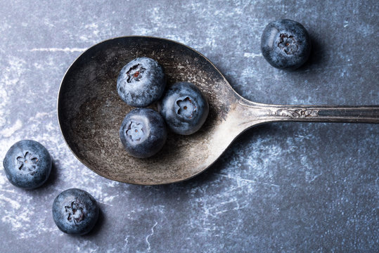 Fresh blueberries on an Vintage Spoon