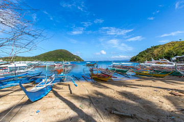 Fototapeta na wymiar Puerto-Galera, Philippines - view on Balatero Cove bay fishermans village and boats