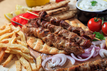 Grilled meat skewers on a pita bread