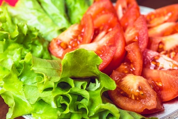 Sliced tomatoes and lettuce