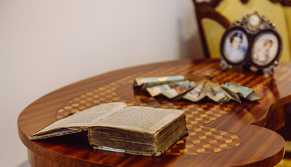 Open antique book on an old table