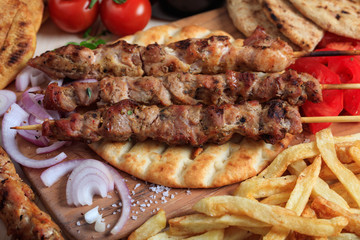 Grilled meat skewers on a pita bread