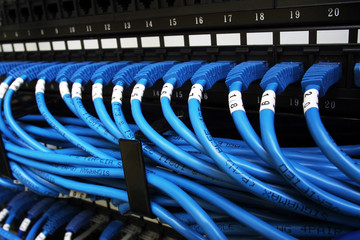 Network cable and switch in server room with empty space for labels