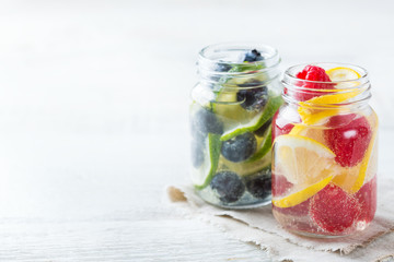 Lemon lime berries fresh infused water detox drink cocktail lemonade