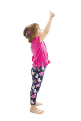 Little baby girl showing something above her, isolated on white background