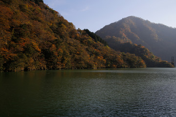 River and autumn leaves and mountains
