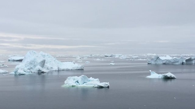 view of the icebergs at Greenland, going between to glaciers.