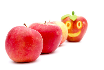 red apple, smiling face, food concept