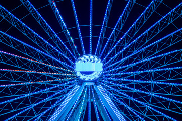 Big wheel lit up at night