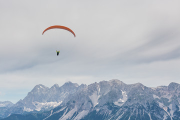 paraglider in front of mountain chain Dachsteinmassiv