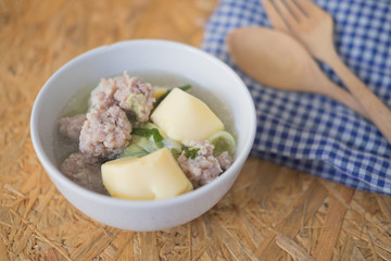 Clear soup with vegetables, egg tofu and minced pork