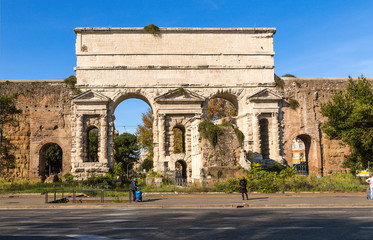 Fototapeta premium Rome, Italy. Gate of Porta Maggiore (1st century AD), tomb of Evrisak - ruins with round holes (1st century BC)