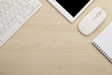 Modern working business desk with keyboard, smartphone, mouse and notepad. Top view with copy space