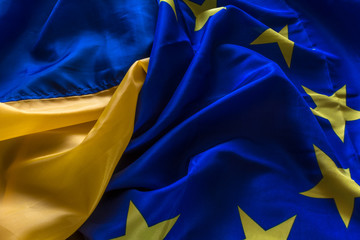 The flag of Ukraine and the flag of the European Union are woven together