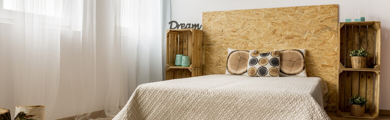Fototapeta na wymiar Minimalist bedroom with DIY racks