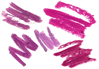 Collection of smudged lipsticks isolated on white