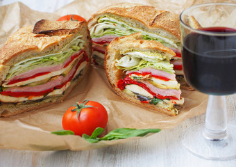 Mediterranean Pressed Picnic Sandwich with mozarella, grilled vegetables and ham