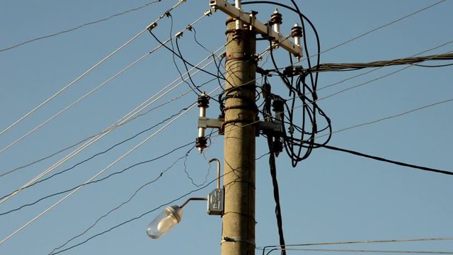 concrete electric pillar with wires & lamp.
