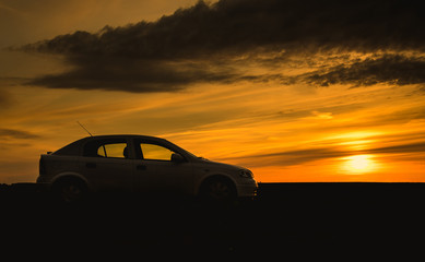 Fototapeta na wymiar Car silhouette in sunset