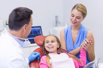 Fototapeta premium Dentist interacting with young patient