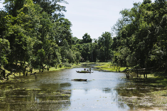 Vietnamese family fishing in the jungle.
