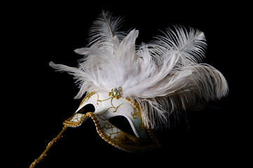 White and gold venetian mask isolated on black