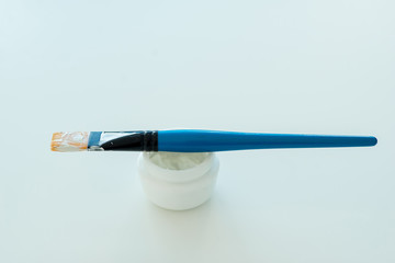 Cosmetic mask with a brush