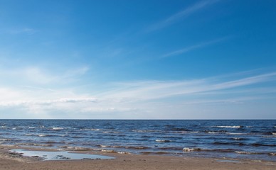 Jurmala (Riga), Latvia - April 16, 2017:  The panoramic view of sea amid nice blue sky with clouds