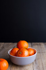 mandarins on gray plate