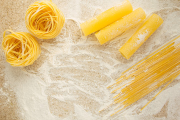 Tagliatelle, cannelonni, spaghetti on the table