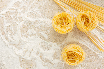 Tagliatelle, spaghetti on the table