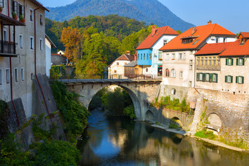Fototapeta na wymiar Old Stone bridge in Skofja Loka town, Slovenia