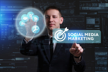 Business, Technology, Internet and network concept. Young businessman working on a virtual screen of the future and sees the inscription: Social media marketing