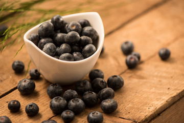 Blueberry Honey with blueberries and liquid honey in jar