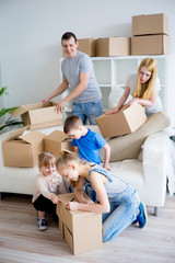 Family unpacking boxes