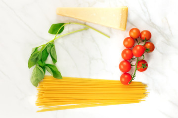 Basic pasta ingredients, including spaghetti and cheese