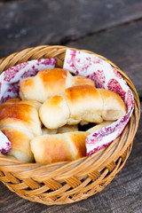 homemade scones on the basket - dark wooden table