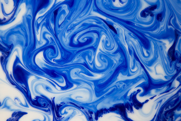 abstract background of splattered blue ink blots