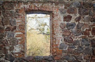 old ruined stone building with a hole in the wall