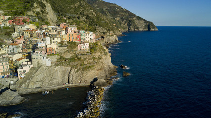 Aerial video footage with drone on Manarola , one of the famous Cinqueterre country, small village with colored houses on the cliff over the sea