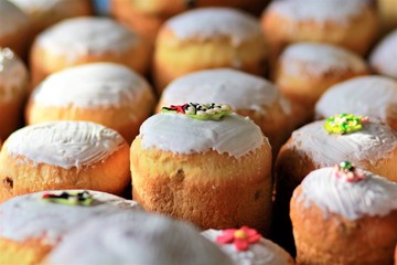 Freshly baked easter bread loaves with icing and decoration