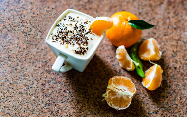 cup of yogurt and tangerines