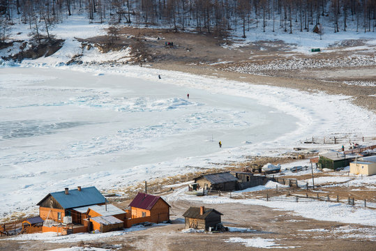 The village in Winter Frozen Lake Baikal view from on the Moutain, Olkhon Island, Russia