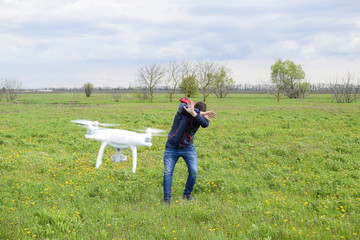 A man hides himself from a collision with a drone. Quadrocopter flies to the person