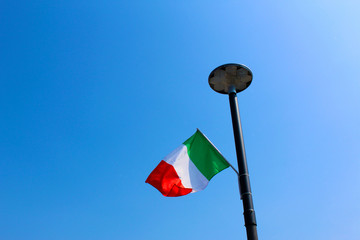 Italian flag on a modern public lamp