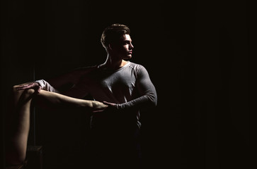 Sexy, naked, female legs touching handsome man