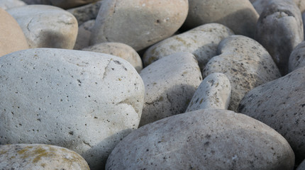 Texture of large smooth gray stones, background