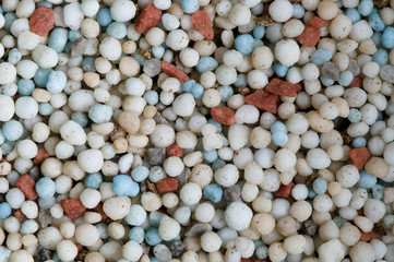 Colorful fertilizer granules macro background