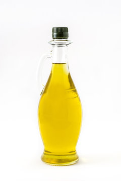 Virgin olive oil in a crystal bottle isolated on white background

